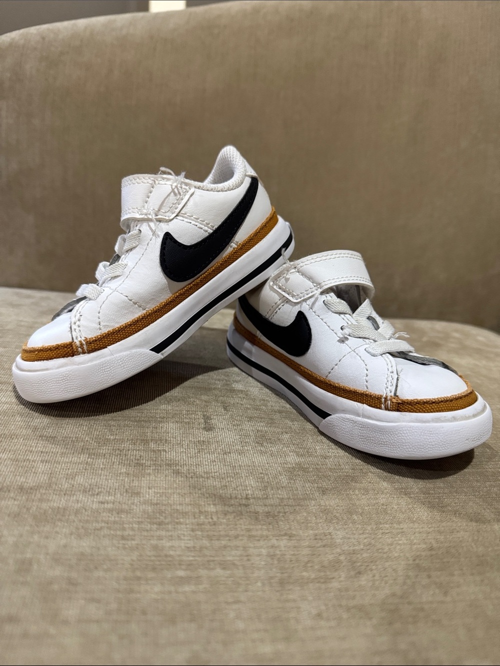 Nike Kids White Sneakers with Black Swoosh and Brown Trim